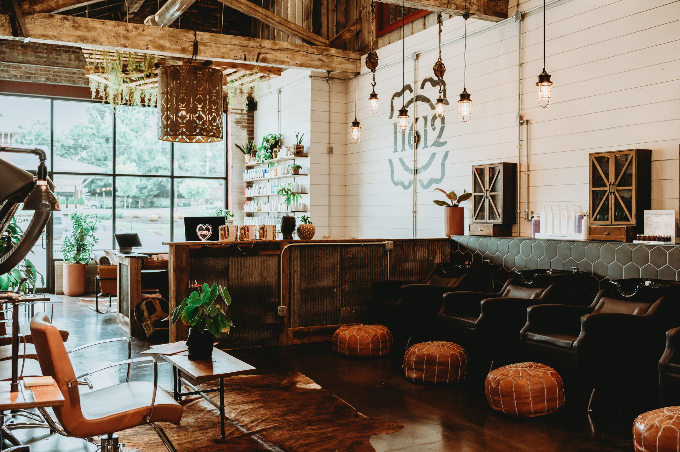 The Refinery Hair Lounge salon interior with styling stations and wash area